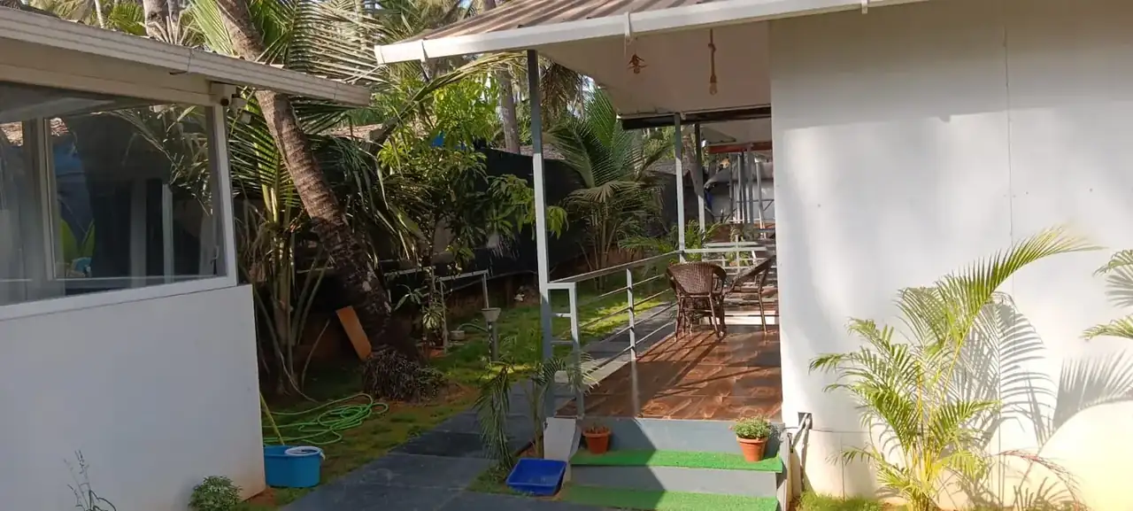 Saffron Sun Palolem veranda and garden area beside the guest rooms